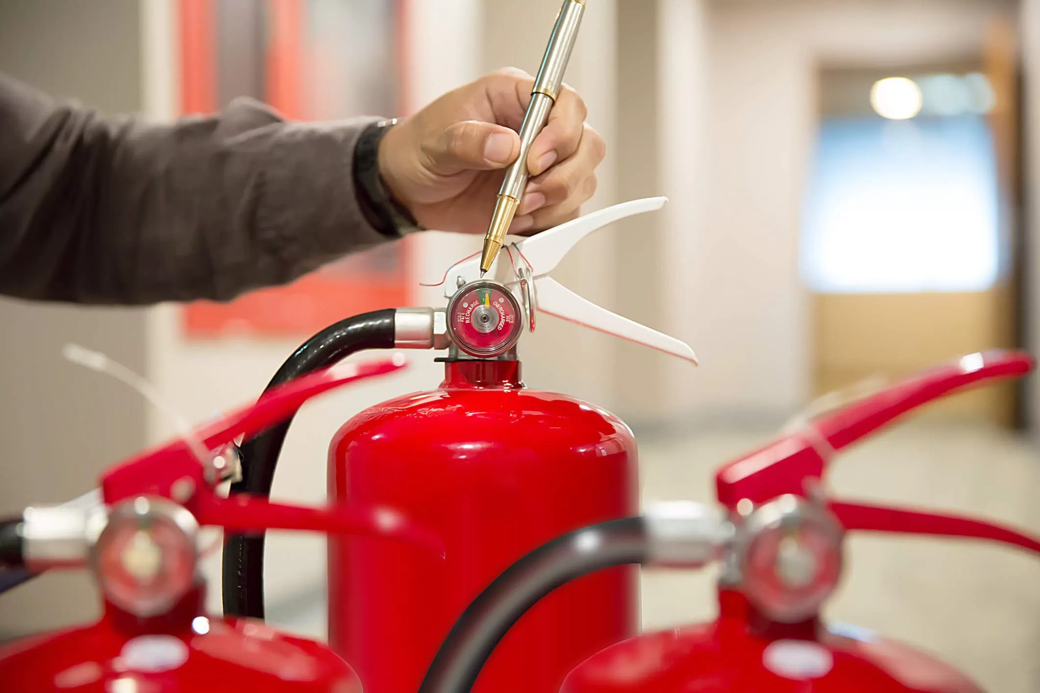 Engineer checking Industrial tank of fire extinguisher.